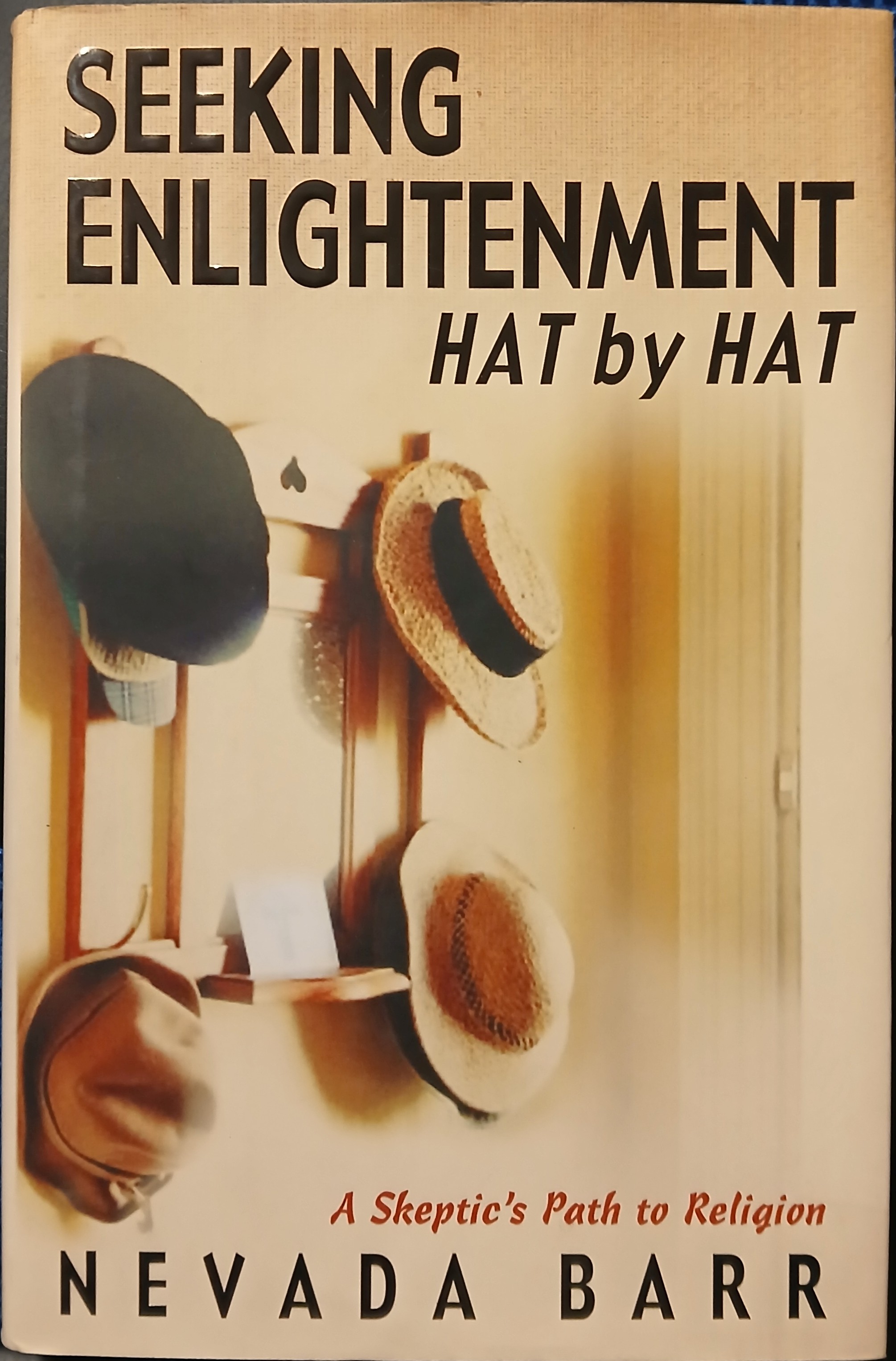 Seeking Enlightenment. Hat by Hat: A Skeptic's Path to Religion