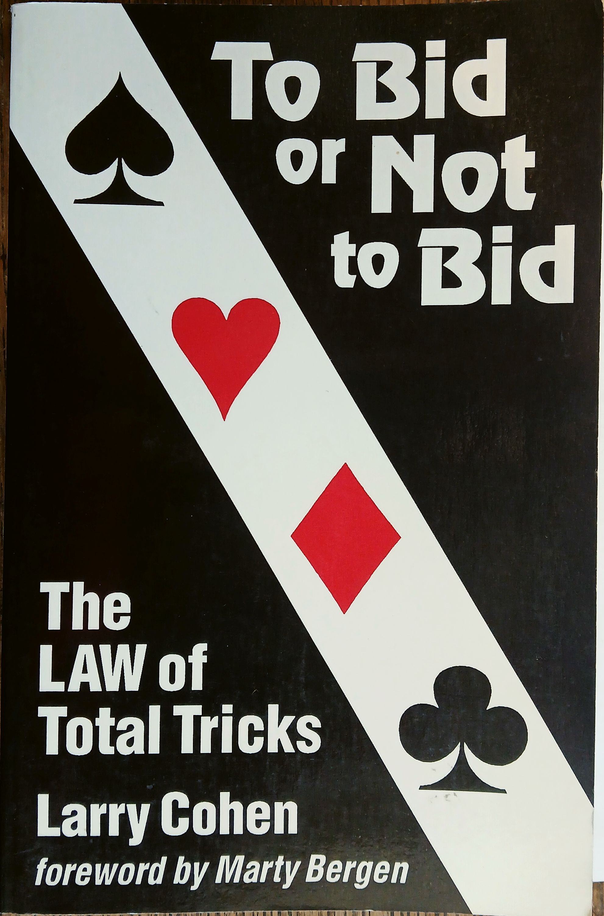 To Bid or Not to Bid: The Law of Total Tricks